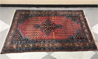 Medium sized red and blue area rug