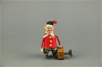 Schuco Clown with Suitcase Wind-Up Toy