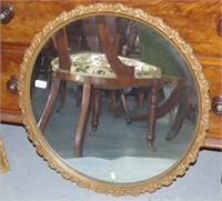 Round gilt framed mirror