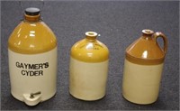 Three English stoneware demijohn bottles