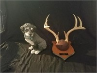 Set of horns and dog figurine