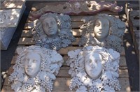 Architectural faces, cherubs and scrolls
