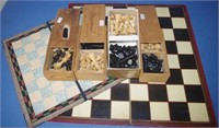 Four sets of wooden chess pieces