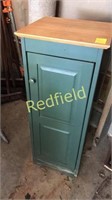 Small green storage cabinet
