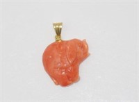 Pink coral elephant pendant on 18ct gold bale