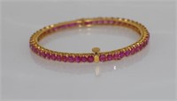 Yellow gold and ruby hinged bracelet