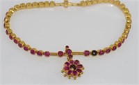 Yellow gold and ruby necklace