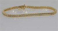 14ct gold and channel set diamond tennis bracelet