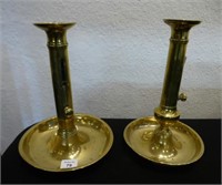 Two brass push-up candlesticks