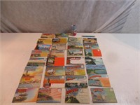 Vingt-cinq livrets de cartes postales anciennes