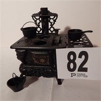 CRESCENT CAST IRON TOY STOVE WITH POTS AND PANS 8