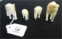 Four carved ivory elephant figures