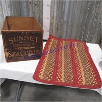 Sunset Soda Crackers box, braided rug