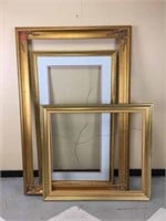 A collection of oversized ornamental frames