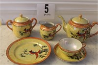 TWENTY ONE PIECE PORCELAIN TEA SETTING HAND