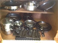 Contents of Cabinet Under Stove (Pots)
