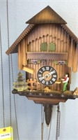 German Cuckoo Clock With Man Chopping Wood