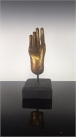 Gold leaf hand of Buddha sculpture