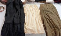 Petticoats (3). Black satin, brown cotton, wool