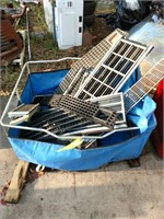 Bin of miscellaneous car grills