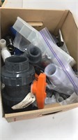 Box of new plumbing supplies, 2 inch union ball