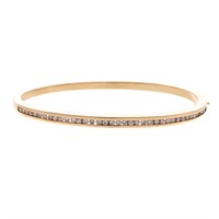 A Lady's Diamond Bangle Bracelet in 14K Gold