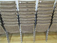 (8) - UPHOLSTERED BROWN STACKING CHAIRS