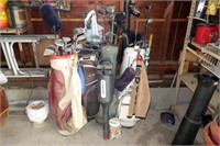 Lot, 4 golf bags, with assorted golf clubs