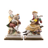 Pair of painted porcelain musician figures