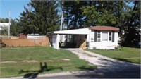 HOUSE TRAILER W/CARPORT & UTILITY SHED ON LOT