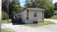 HOUSE TRAILER W/UTILITY SHED ON LOT