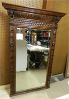 Large Neo Renaissance Carved Oak Beveled Mirror.