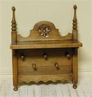 Finial and Rosette Crowned Oak Wall Rack.