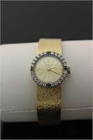 Corum 18ct gold watch with diamonds
