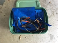 green tote with tarps and jumper cables