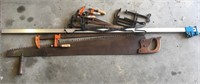 antique saw and wood clamps