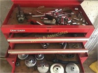 Craftsman rolling toolbox filled with assorted
