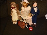 5 Porcelain dolls and a bear