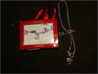 Charm bracelet and heart necklace