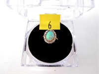 Yellow gold oval opal ring with diamond accents