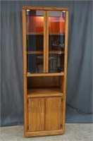 Lighted Oak Curio Cabinet with Storage on Casters