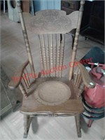 > Wooden rocking chair with leather studded seat