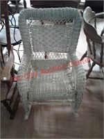 > Wicker rocking chair