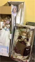 Three porcelain head dolls, two in wedding