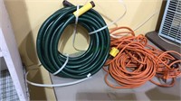 Two 50 foot extension cords, garden hose, (793)