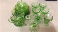 Matching 27 pieces of green depression glass,
