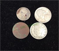 Four coins, 1963 dime, 1912 nickel, 1958 nickel,