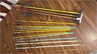 12 vintage arrows, and oak arrow rack, most of