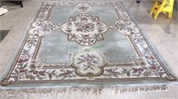 Chinese room rug with a light green and beige