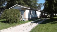 HOUSE TRAILER W/UTILITY SHED ON LOT